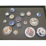 A collection of fourteen Chinese 18th and 19th century porcelain tea pot lids and caddy lids, four