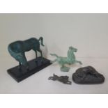 A resin recumbant hound, 15cm long, a bronze rabbit and two metal horses with green patina finish,