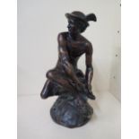 A bronze of Mercury in the style of Jean-Baptiste Pigalle, seated attaching his wings, unsigned,