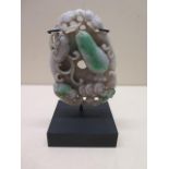 A jade carving on stand, carving 10cm x 7cm, in good condition