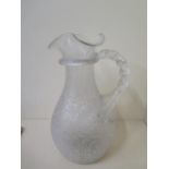 An unusual crackle glass lemonade jug with ice compartment and spiral twist handle, 31cm tall,