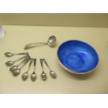A silver bowl with blue enamel lining, 16.5cm diameter, eight siam silver Neillo coffee spoons and a