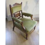 A late Victorian upholstered open armchair