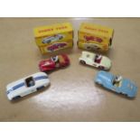 Four Dinky toys sports cars, Sunbeam Alpine no 107, Cunningham C-5R Road Races no 133, MG Midget