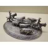 A continental silver group of bulls and horse riders, 16cm x 13cm approx 10.6 troy oz, generally