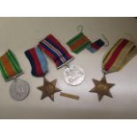 Four WWII Campaign medals, all unnamed with a North Africa bar