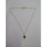 An 18ct yellow gold sapphire diamond pendant on an 18ct chain, 39cm long, both marked 750, pendant