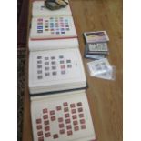 Three Great Britain stamp albums containing six Twopenny Blues and over 100 Penny Reds together with