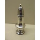 A silver shaker, Birmingham 1930, 19cm tall, approx 4.3 troy oz, some small dents, hallmarks worn