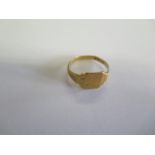 A hallmarked 18ct yellow gold signet ring, size V, approx 3.7 grams, in worn condition