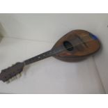 A rosewood Mandolin, 62cm long, glued repair to side otherwise reasonably good