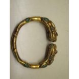 A gilt metal dragon bangle, 8cm x 7cm, external dimension, approx 128 grams, in good condition