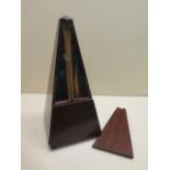 A French mahogany cased metronome with plaque, dated 1815, 30cm tall, in working order, slight