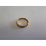 A hallmarked 22ct yellow gold ring, size O, approx 5.4 grams, generally good with some usage marks