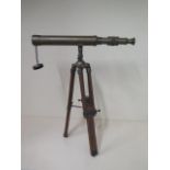 A brass telescope on stand, 50cm tall x 41cm long, in working order and no obvious damage