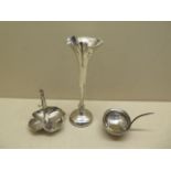 A silver weighted trumpet vase, 20cm tall, a silver ring stand and a coin inset punch ladle bowl,