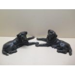A pair of well modelled bronze dogs, 35cm long, both with repaired legs, both unsigned, some