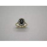 An 18ct gold sapphire and diamond ring, marked 18ct, ring size O, head approx 11mm x13mm, some