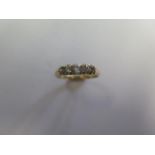 A yellow gold five stone diamond ring, tests to above 9ct, ring size Q, approx 2.3 grams, diamonds