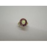 A 9ct yellow gold opal and ruby hallmarked ring, size P, approx 2.8 grams, head approx 12mm x14mm,