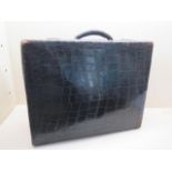 A Vintage black crocodile suitcase 48cm x 18cm 38cm, locks working, some wear mainly to corners