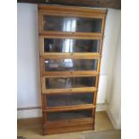 A light oak six section stacking Globe Wernicke bookcase with base and top, 190cm tall x 86.5cm x