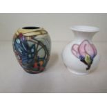 Two small Moorcroft vases, 9.5cm tall, both good condition, white vase is crazed