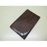A crocodile gentleman's wallet with full length back pocket, 16.5cm x 10.5cm, in good condition ,