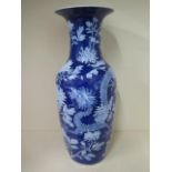 An impressive 19th century Chinese porcelain blue and white vase decorated with embossed peony and