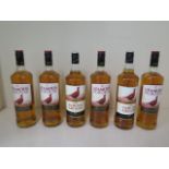 Six bottles of the Famous Grouse blended Scotch whisky, all sealed and levels good