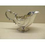 A silver sauce boat, 19cm long, approx 10 troy oz, no engraving generally good some wear to