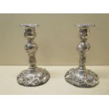 A pair of early silver weighted candlesticks, 1824 Sheffield maker I &v IW & Co, 18cm tall,