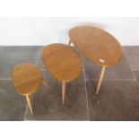 An Ercol light elm nest of pebble tables, some minor marks but good condition, 41cm tall x 65cm x