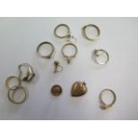 Six 9ct yellow gold coin mounts, three 9ct rings, a 9ct earring and a 9ct stud, total weight