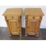 A pair of waxed bedside cabinets with a drawer above a door - Height 74cm x 44cm x 38cm