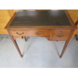 An Edwardian inlaid mahogany two drawer desk with an inset top, 77cm tall x 84cm x 50cm, with key ,