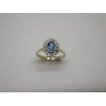 A hallmarked 9ct blue topaz and diamond ring, size N/O, approx 2.7 grams, head approx 11mm x 8mm, in