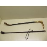 A silver tip riding crop and a horn handle crop, 62cm long, some wear to both, repair to horn handle