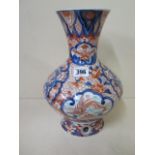 An Imari pattern vase with open base, 29cm tall, in good condition