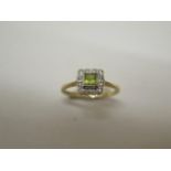 A peridot and diamond 18ct hallmarked ring, size N, approx 2.5 grams, in good condition
