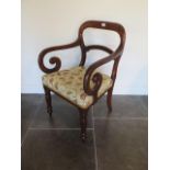 A 19th century mahogany scroll armchair with re-upholstered seat