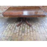 A 19th century mahogany and rosewood oblong breakfast table on a quatrefoil splayed base terminating
