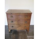 A Georgian mahogany three drawer chest with a brushing slide in need of restoration, 87cm tall x