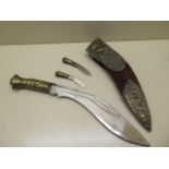 A Kukri with embossed Gurka crossed knives decoration to the scabbard, length 41cm, reasonably