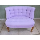 A Oliver Bonas of Cambridge button back love seat two seater sofa in pink, 73cm tall x 101cm wide