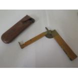 A good quality folding pocket 12" surveyors level with compass and levels in original leather case