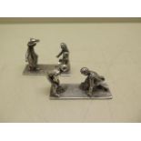 Two silver place holders of children playing, maker TCJ London hallmarks, 4.5cm long, approx 1.8