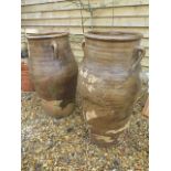 A pair of oversize terracotta earthenware olive pots, 100cm tall, top measures 44cm diameter