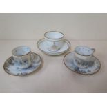 A fine pair of Japanese eggshell porcelain cups and saucers, well decorated with warriors, the cup