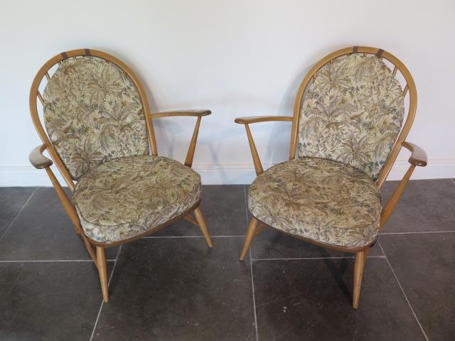 A pair of Ercol light elm low armchairs, 82cm tall x seat height including cushion 38cm, some wear